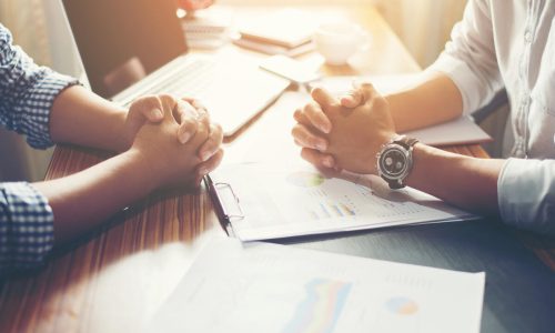 Close-up of  Team Business people discussing a financial plan at office.