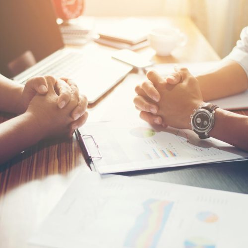 Close-up of  Team Business people discussing a financial plan at office.